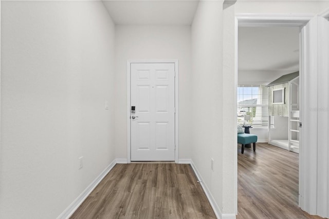6708 162nd Pl E, Parrish, FL 34219 - doorway featuring wood finished floors and baseboards
