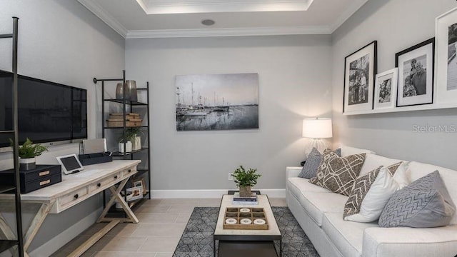 tiled living area with a tray ceiling, crown molding, and baseboards