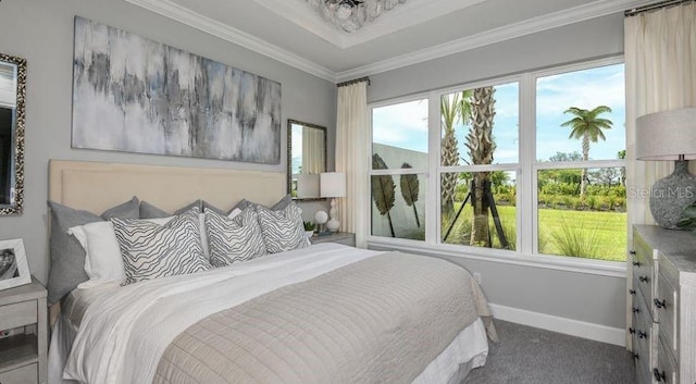 carpeted bedroom with crown molding and baseboards