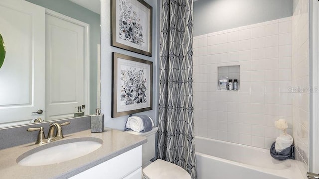 bathroom with toilet, vanity, and shower / tub combo