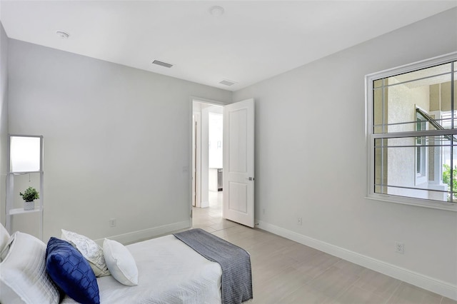 bedroom featuring baseboards