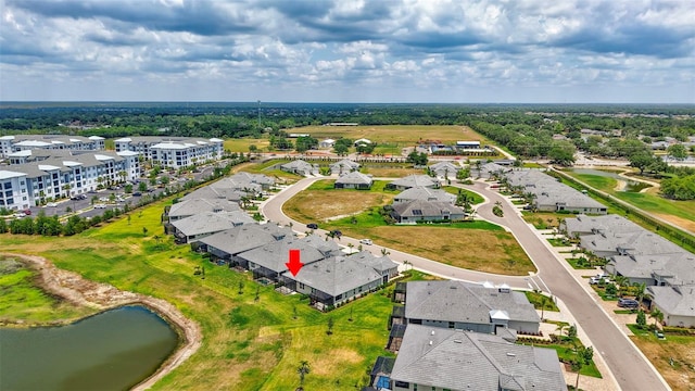 aerial perspective of suburban area with a nearby body of water