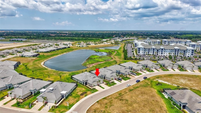 aerial perspective of suburban area with a nearby body of water