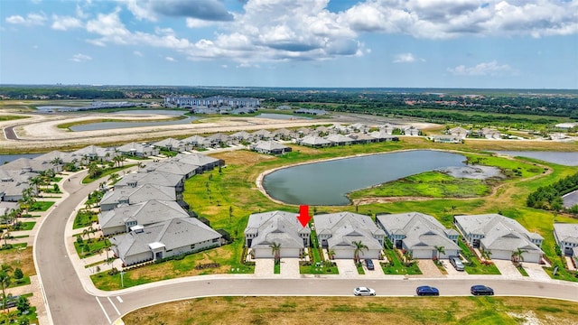 aerial perspective of suburban area with a large body of water