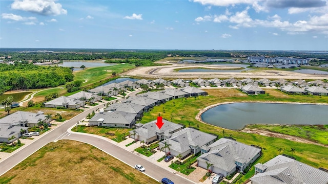 aerial view of residential area featuring a nearby body of water
