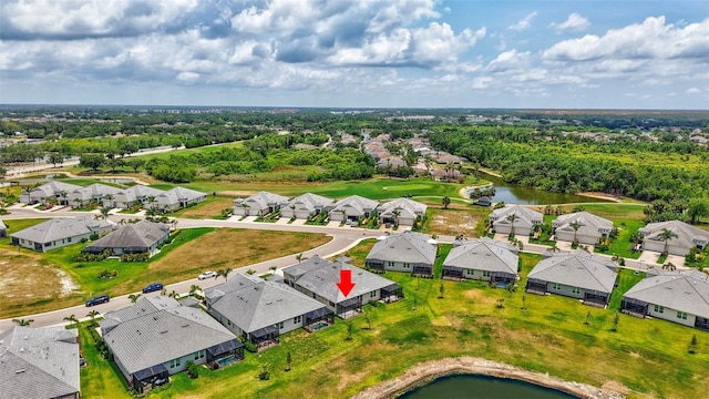 aerial view of residential area with a large body of water