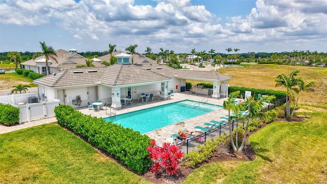 view of swimming pool featuring a patio and central air condition unit
