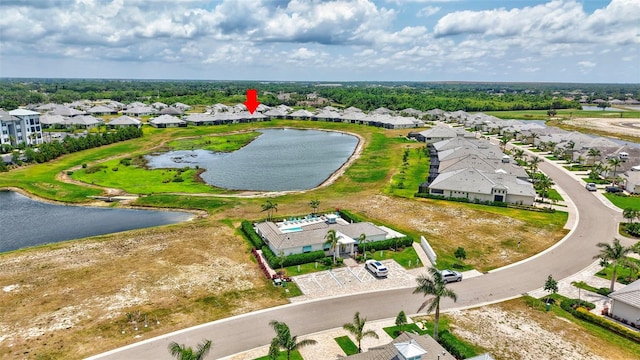 aerial perspective of suburban area with a large body of water