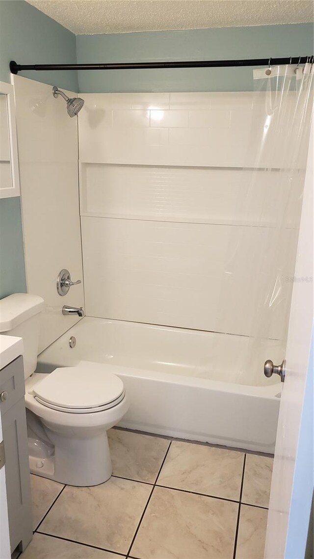 4304 78th St W Unit 4304, Bradenton, FL 34209 - bathroom featuring shower / tub combo with curtain, vanity, toilet, tile patterned floors, and a textured ceiling