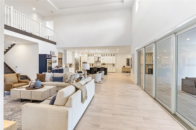 living room with a high ceiling and stairs