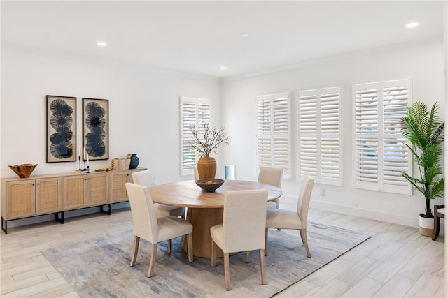 dining area with recessed lighting, light wood finished floors, baseboards, and ornamental molding