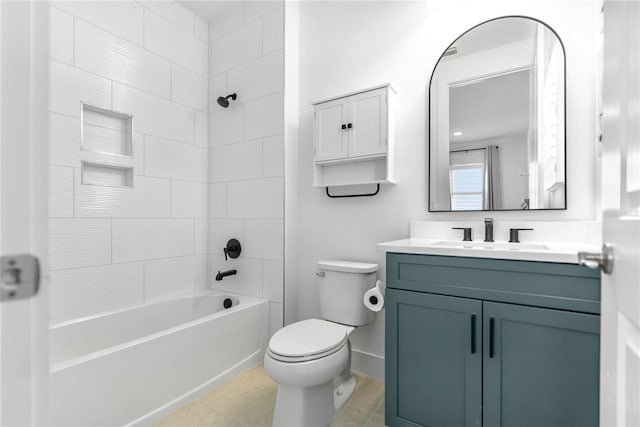 bathroom with toilet, vanity, tile patterned floors, and bathing tub / shower combination