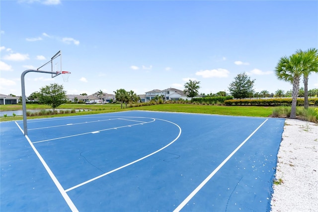 view of sport court featuring community basketball court and a yard