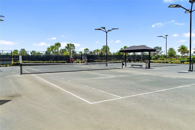 view of tennis court with fence