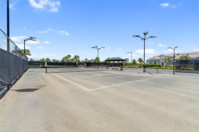 view of tennis court with fence