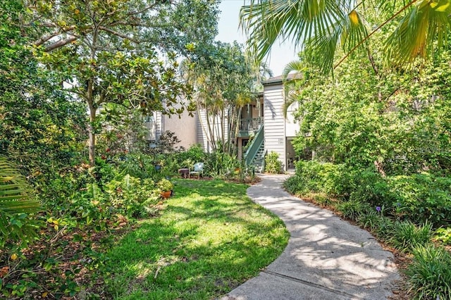 1629 Pelican Cove Rd Unit 138A, Sarasota, FL 34231 - view of grassy yard featuring stairway