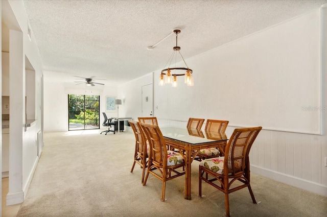 1629 Pelican Cove Rd Unit 138A, Sarasota, FL 34231 - dining area featuring light carpet, a textured ceiling, ceiling fan, and a chandelier