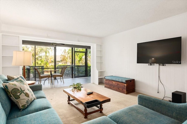 1629 Pelican Cove Rd Unit 138A, Sarasota, FL 34231 - carpeted living room featuring a textured ceiling