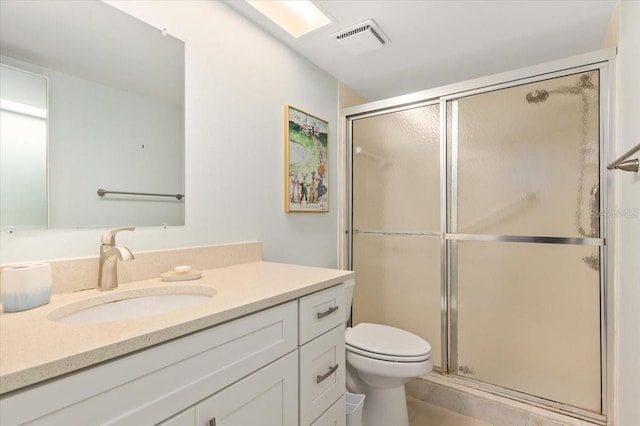 1629 Pelican Cove Rd Unit 138A, Sarasota, FL 34231 - bathroom featuring a stall shower, toilet, and vanity
