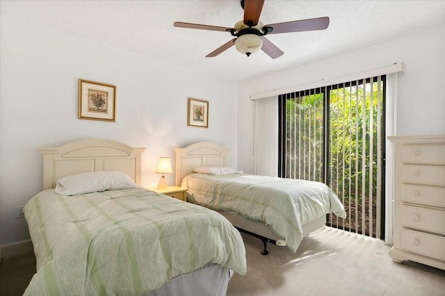 1629 Pelican Cove Rd Unit 138A, Sarasota, FL 34231 - carpeted bedroom featuring ceiling fan and access to exterior