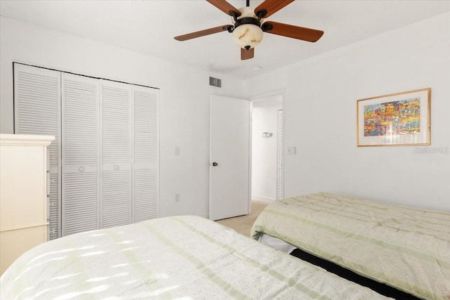 1629 Pelican Cove Rd Unit 138A, Sarasota, FL 34231 - bedroom with a closet, ceiling fan, and light carpet