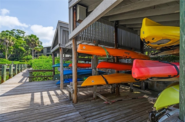 1629 Pelican Cove Rd Unit 138A, Sarasota, FL 34231 - wooden deck featuring boat lift and a dock