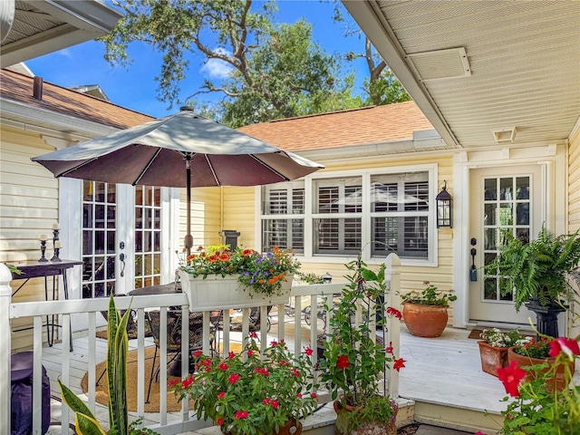 6402 23rd Avenue Dr W, Bradenton, FL 34209 - view of wooden balcony with french doors and a deck