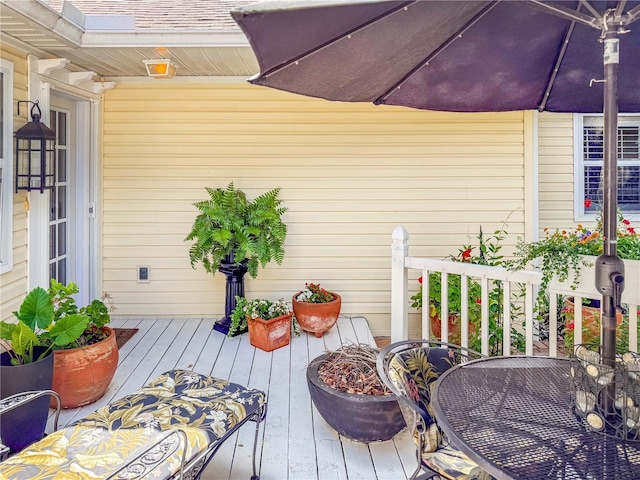 6402 23rd Avenue Dr W, Bradenton, FL 34209 - wooden terrace featuring outdoor dining space