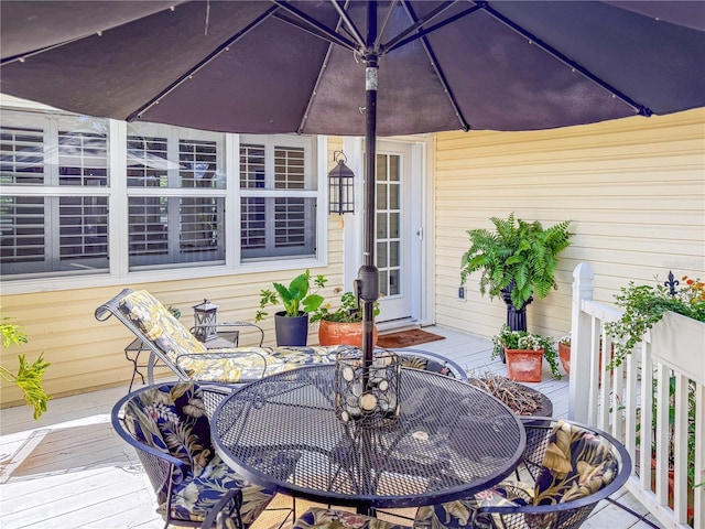 6402 23rd Avenue Dr W, Bradenton, FL 34209 - wooden terrace with outdoor dining space