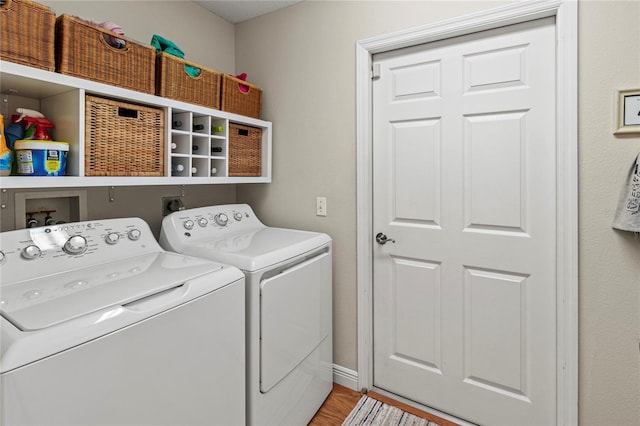 6402 23rd Avenue Dr W, Bradenton, FL 34209 - laundry room with washer and clothes dryer and light wood-style floors