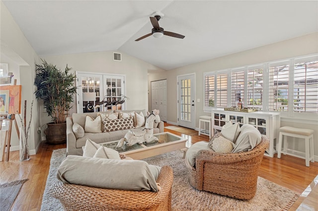 6402 23rd Avenue Dr W, Bradenton, FL 34209 - living room featuring ceiling fan, light wood-style flooring, lofted ceiling, and baseboards