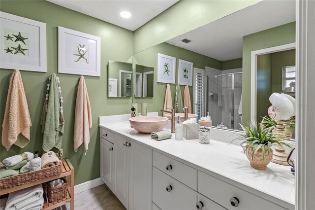 6402 23rd Avenue Dr W, Bradenton, FL 34209 - bathroom with a shower stall, vanity, marble finish floors, and baseboards