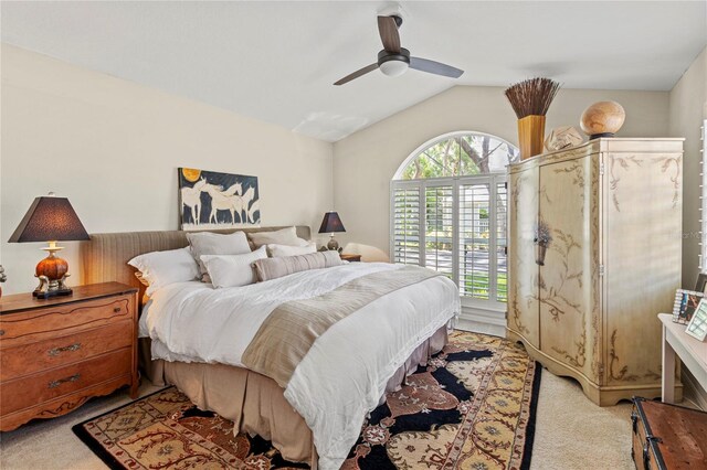 6402 23rd Avenue Dr W, Bradenton, FL 34209 - bedroom with light colored carpet, lofted ceiling, and ceiling fan