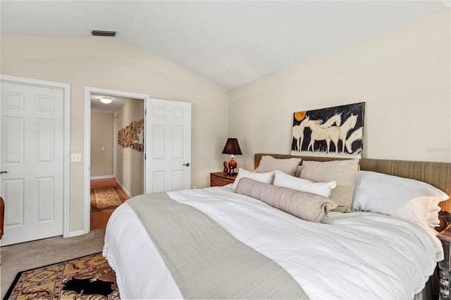 6402 23rd Avenue Dr W, Bradenton, FL 34209 - bedroom featuring vaulted ceiling and carpet