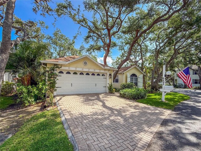 6402 23rd Avenue Dr W, Bradenton, FL 34209 - single story home with decorative driveway and a garage