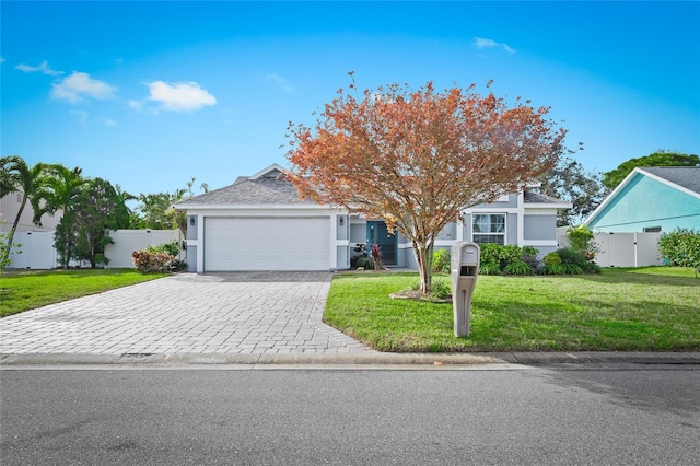 obstructed view of property featuring a garage, decorative driveway, and stucco siding