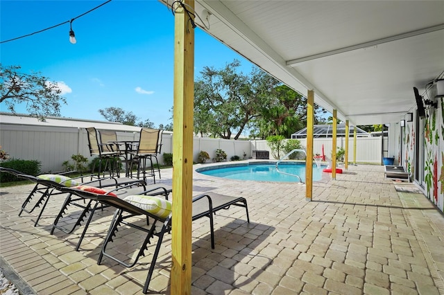 view of pool featuring a patio and a fenced backyard
