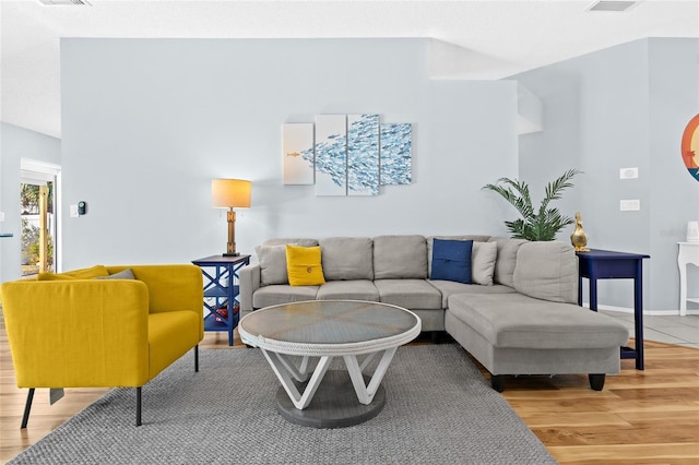 living room featuring light wood-style floors and baseboards