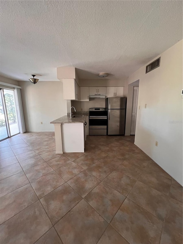 4035 S School Ave Unit D3, Sarasota, FL 34231 - kitchen with stainless steel appliances, white cabinets, a textured ceiling, a sink, and under cabinet range hood