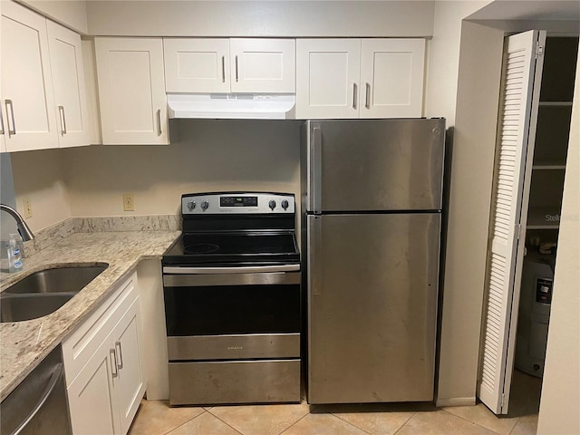 4035 S School Ave Unit D3, Sarasota, FL 34231 - kitchen featuring under cabinet range hood, appliances with stainless steel finishes, a sink, and light tile patterned floors
