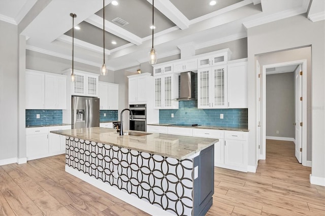 4312 Vasco St, Punta Gorda, FL 33950 - kitchen with wall chimney range hood, appliances with stainless steel finishes, beam ceiling, a large island with sink, and light wood-style floors