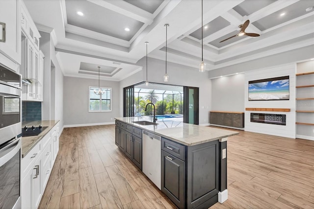 4312 Vasco St, Punta Gorda, FL 33950 - kitchen with a sink, dishwasher, white cabinets, open floor plan, and coffered ceiling