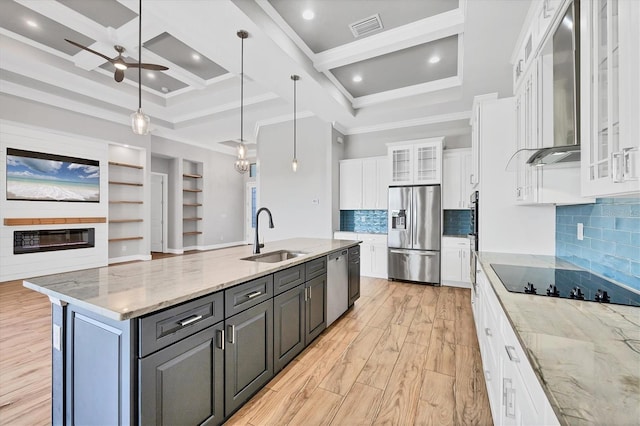 4312 Vasco St, Punta Gorda, FL 33950 - kitchen with stainless steel appliances, a sink, white cabinetry, light wood finished floors, and a ceiling fan