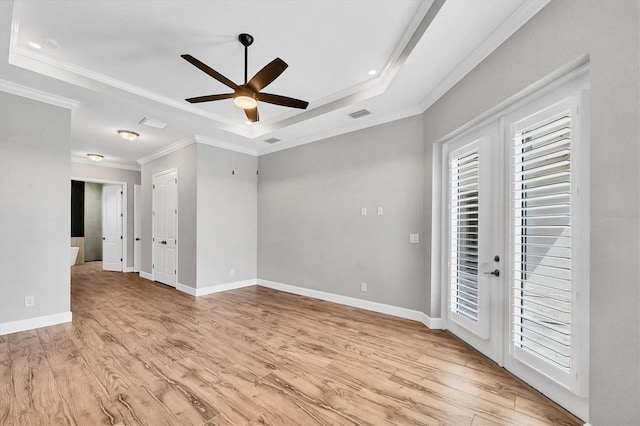 4312 Vasco St, Punta Gorda, FL 33950 - spare room featuring a tray ceiling, a ceiling fan, crown molding, light wood-style floors, and baseboards