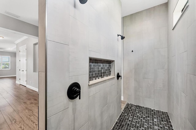 4312 Vasco St, Punta Gorda, FL 33950 - full bath with tiled shower, ornamental molding, baseboards, and wood finished floors