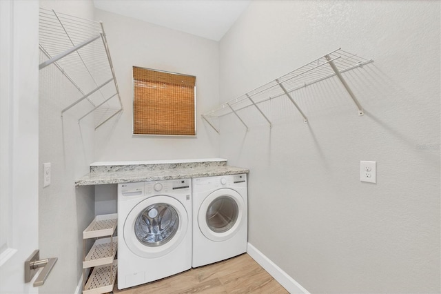 4312 Vasco St, Punta Gorda, FL 33950 - clothes washing area with independent washer and dryer, light wood-style floors, and baseboards