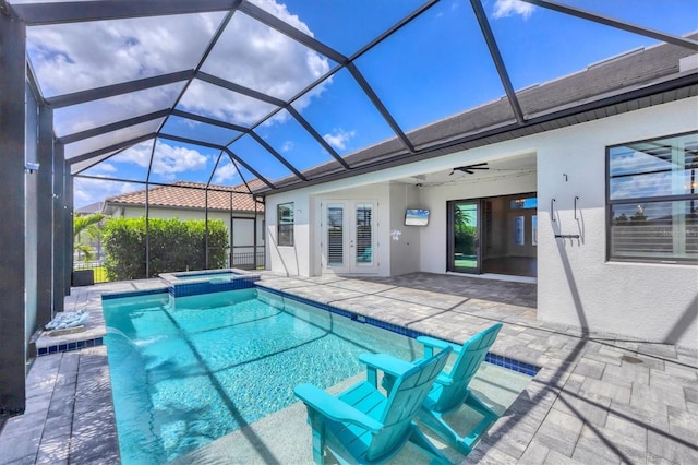 4312 Vasco St, Punta Gorda, FL 33950 - view of swimming pool featuring french doors, a patio area, a pool with connected hot tub, and glass enclosure