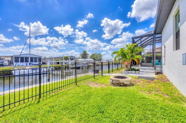 4312 Vasco St, Punta Gorda, FL 33950 - view of yard with an outdoor fire pit, a water view, a residential view, and a lanai