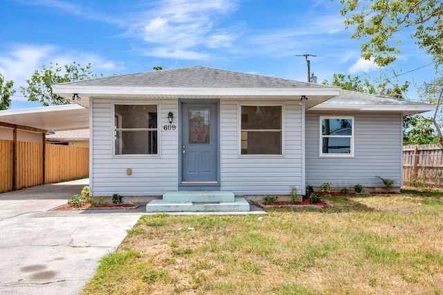 bungalow-style house with concrete driveway