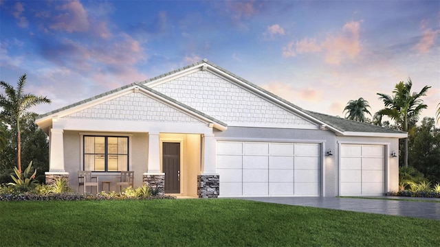 18428 Dayspring Pl, Venice, FL 34293 - craftsman house featuring a garage, a front yard, covered porch, driveway, and stone siding